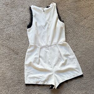 White Sleeveless Romper with Black Trim